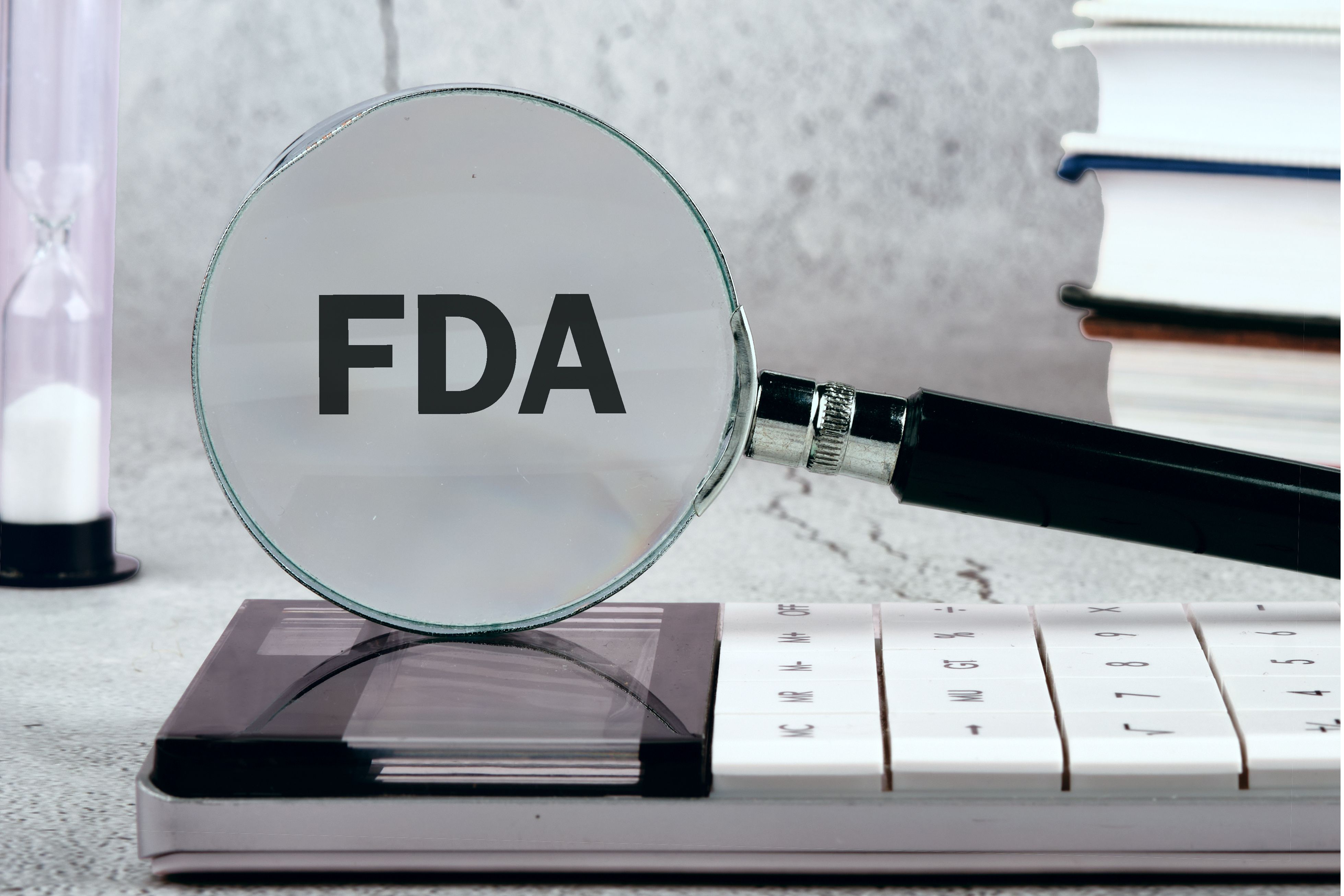 Magnifying glass showing FDA logo -- Image credit: Ihar | stock.adobe.com