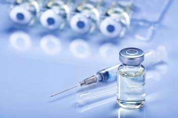 Single use syringe for injection treatment on medical table with vials of liquid drug doses flu shots at background. Vaccination or immunization care concept - Image credit: Mikhailov Studio | stock.adobe.com