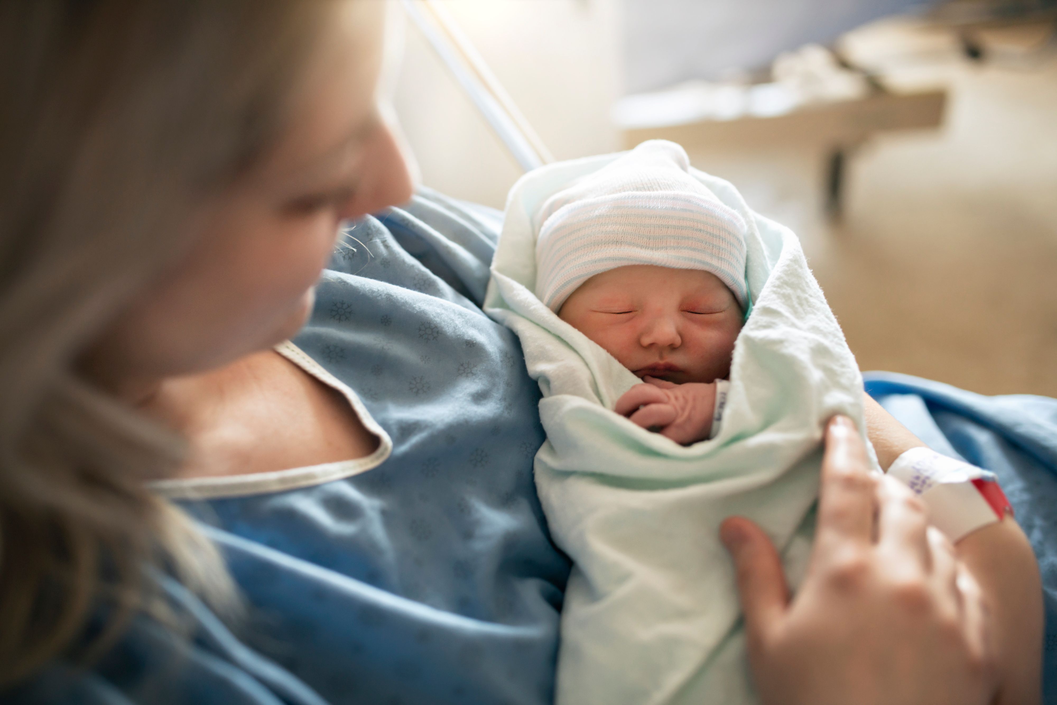 Mother holding her newborn baby -- Image credit: Louis-Photo | stock.adobe.com