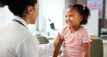 Pharmacist with a pediatric patient -- Image credit: Lawrenson25/peopleimages.com | stock.adobe.com