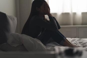 Woman dealing with depression -- Image credit: Pormezz | stock.adobe.com