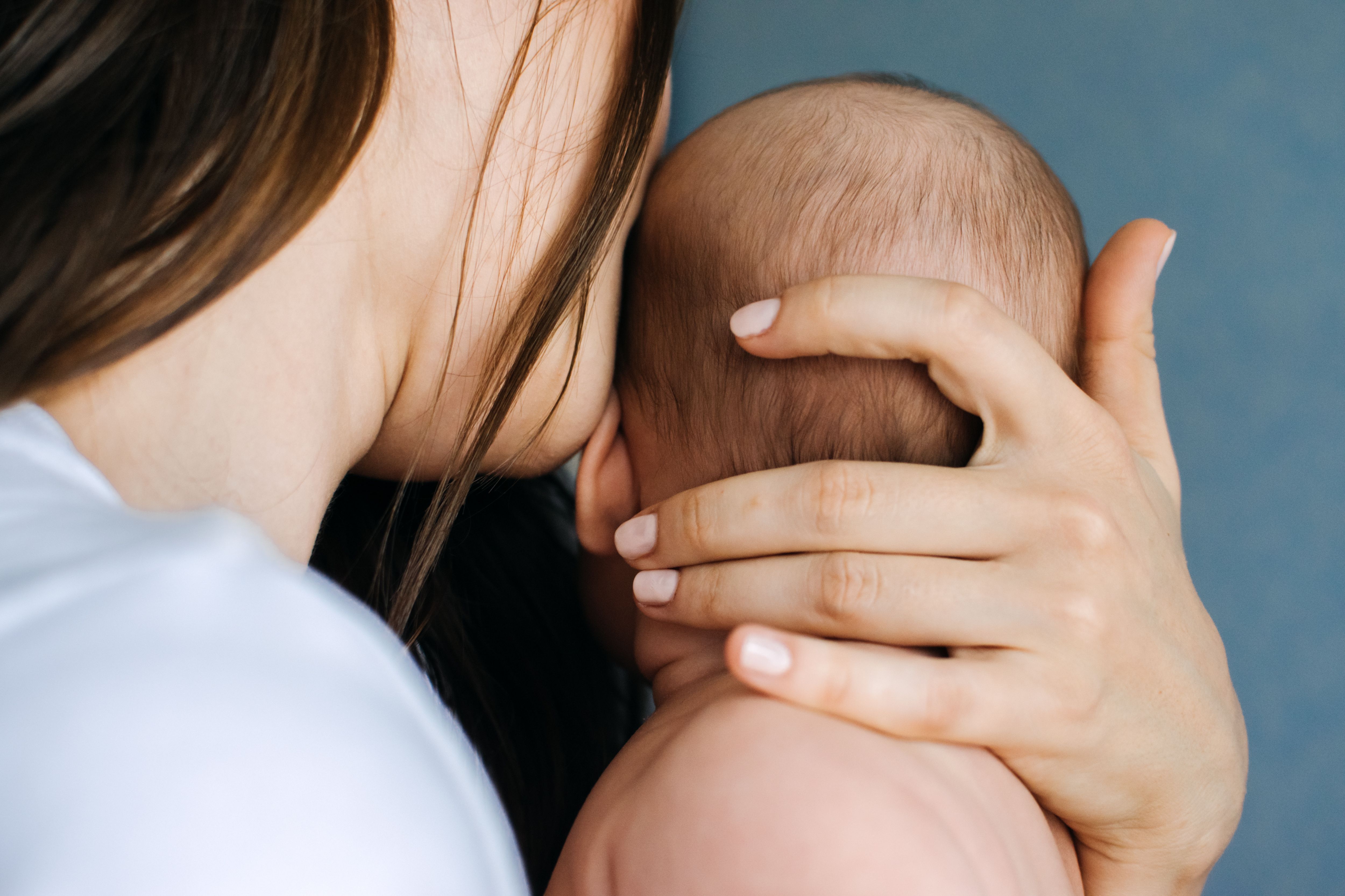 Mental Health in Postpartum Time. Maternal Mental Health. Pregnancy And Postpartum Disorders, postpartum baby blues, depression. Portrait of mother and newborn baby | Image Credit: irissca | stock.adobe.com