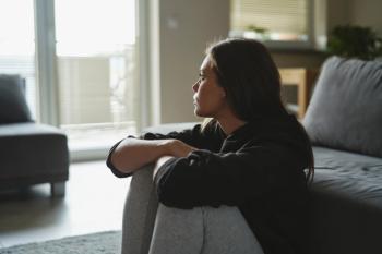 Young woman with CKD and depression -- Image credit: gpointstudio | stock.adobe.com