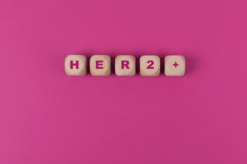 Wooden blocks spelling HER2+ | Image Credit: © AnnJane - stock.adobe.com