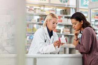 Pharmacist talking with patient -- Image credit: Reese/peopleimages.com | stock.adobe.com