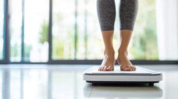 Barefoot Woman on Digital Scale Closeup - Monitoring Weight Loss, Female Fitness and Diet Lifestyle, Kilogram Display and Calorie Management Photo | Image Credit: forenna | stock.adobe.com