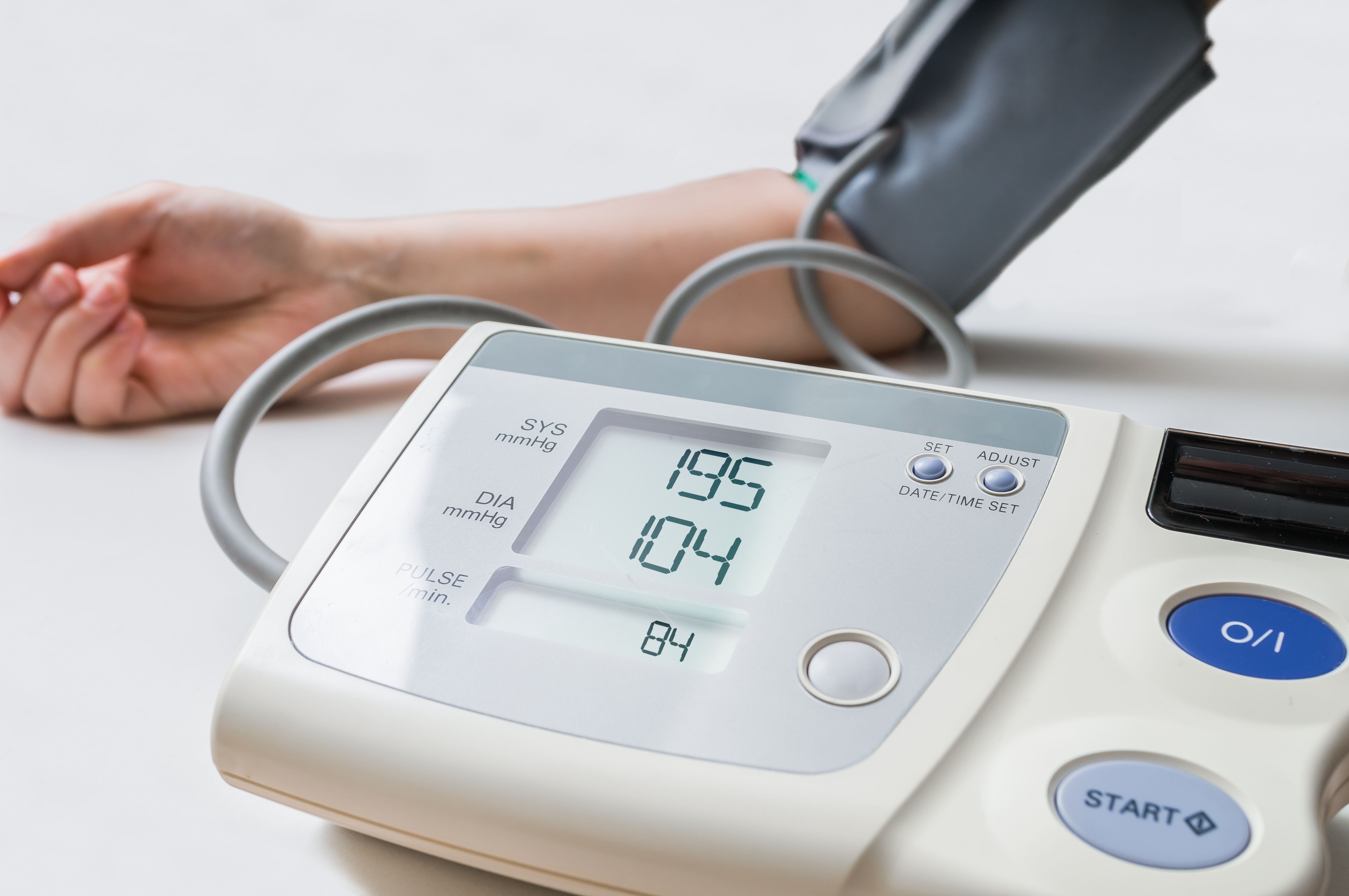 Health care professional taking a patient's blood pressure -- Image credit: vchalup | stock.adobe.com