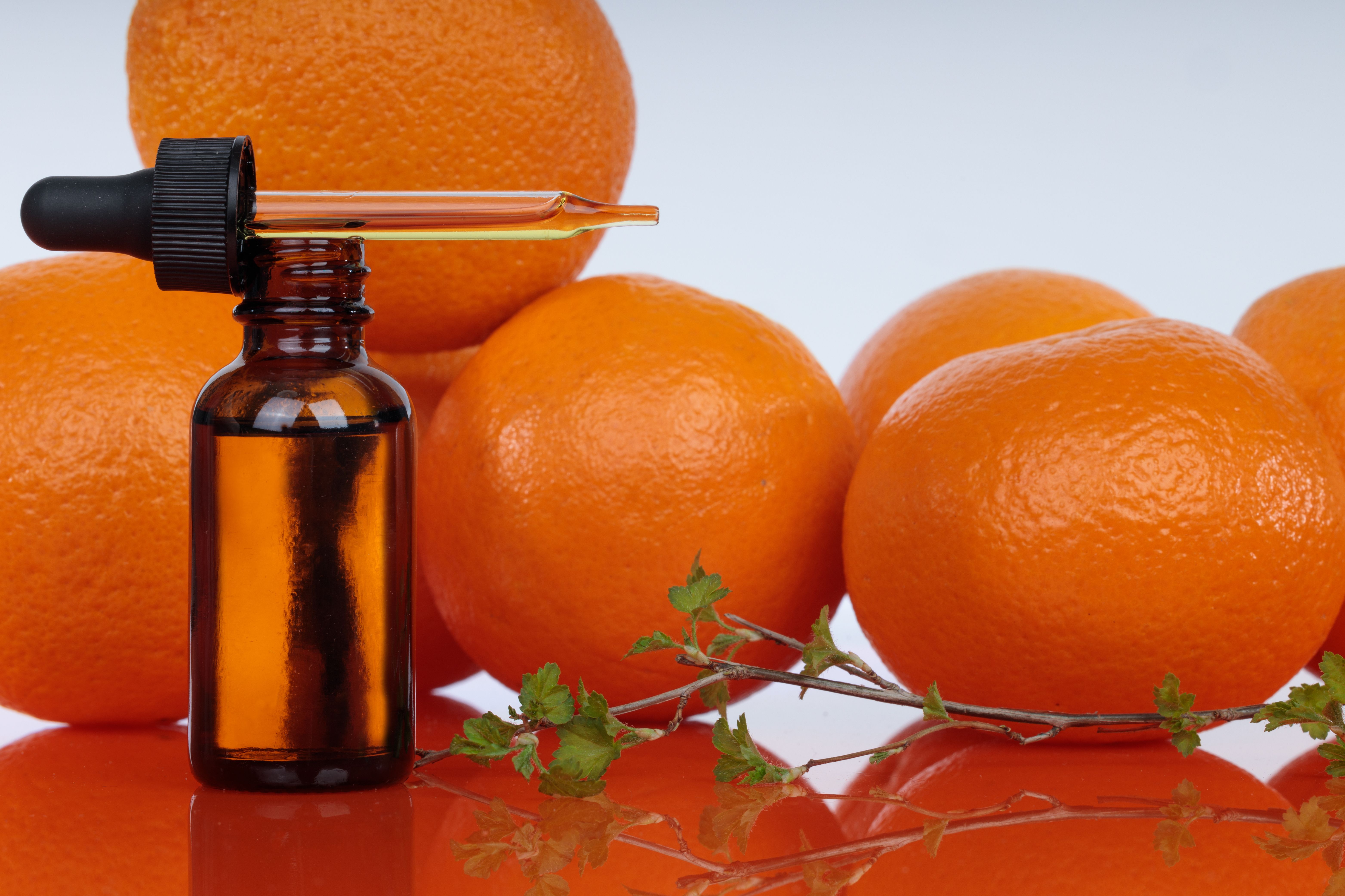 Bottle with essential oils, dropper with oil. Fresh oranges. A natural remedy for depression. | Image Credit: MAXSHOT_PL | stock.adobe.com 