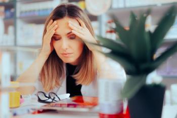 Worried Pharmacist Suffering from Headaches and Stress. Unhappy stressed medical worker feeling overwhelmed - Image credit: nicoletaionescu | stock.adobe.com