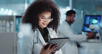 Tablet, reading and woman scientist in laboratory working on medical research, project or experiment. Science, career and female researcher with digital technology for pharmaceutical innovation