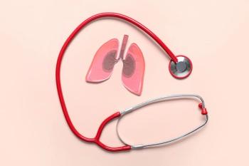 Paper lungs and stethoscope on beige background