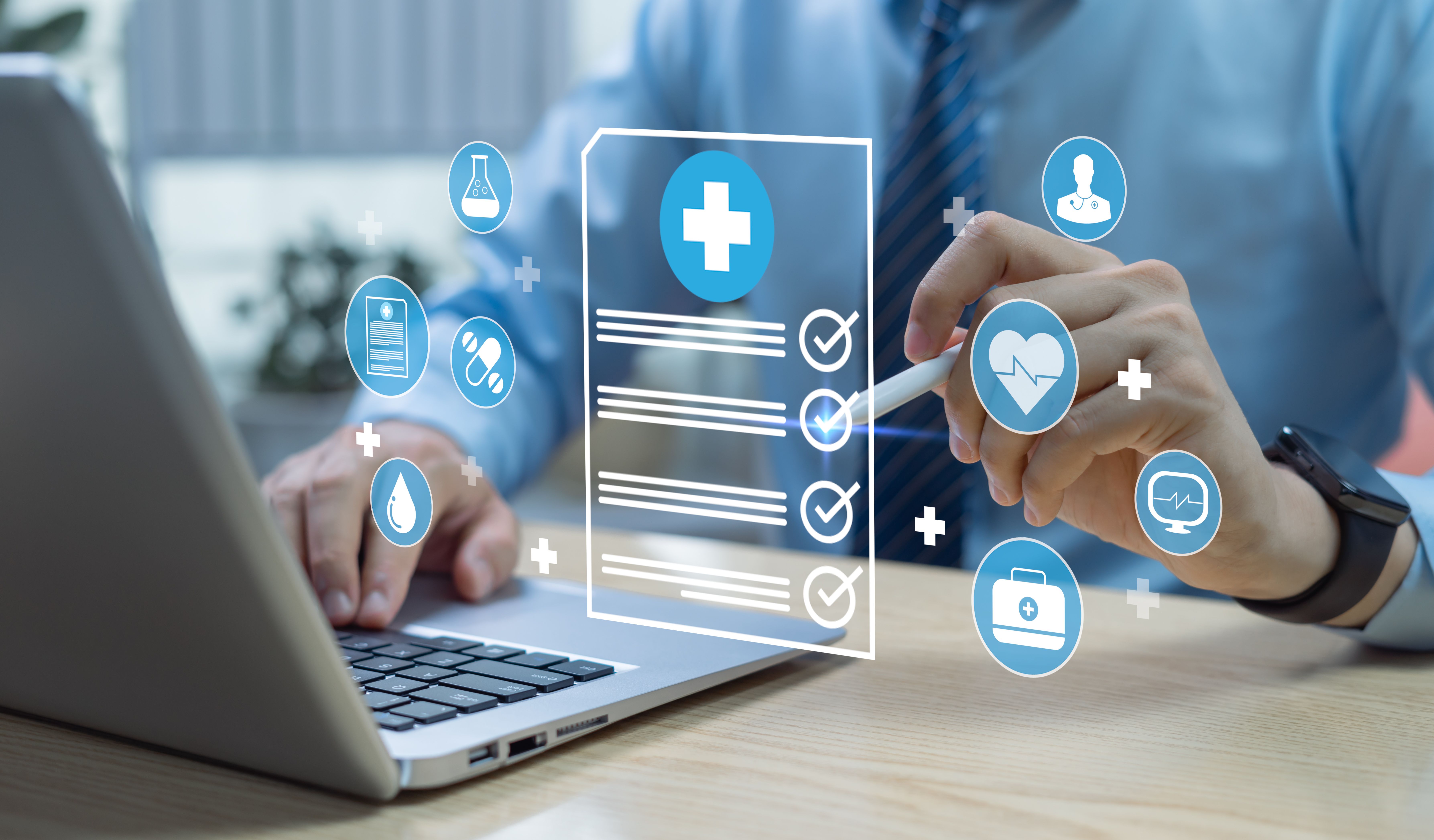 Health care professional using AI on laptop -- Image credit: Father_Studio | stock.adobe.com