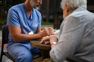 Pharmacist answering patient's health care questions -- Image credit: Halfpoint | stock.adobe.com
