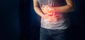 Woman touching stomach painful suffering from stomachache causes of menstruation period, gastric ulcer, appendicitis or gastrointestinal system desease. Healthcare and health insurance concept - Image credit: ipopba | stock.adobe.com