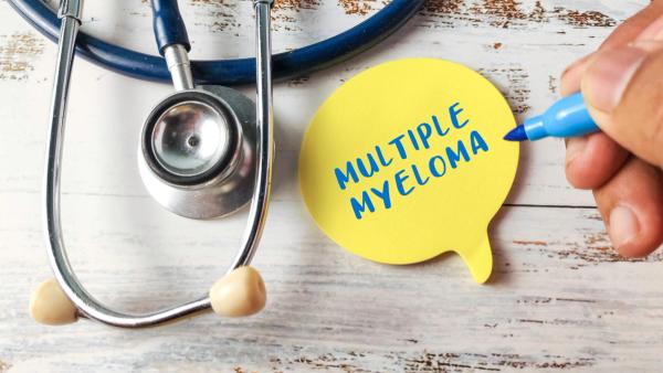 Hand Writing "Multiple Myeloma" on a Yellow Speech Bubble Next to a Stethoscope, Representing Blood Cancer Awareness and Diagnosis | Image Credit: MohamadFaizal | stock.adobe.com