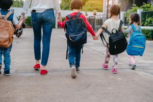 Back to School of Mother and pupil and kids holding hands going to school | Image credit: Kiattisak - stock.adobe.com