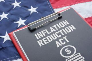 Inflation Reduction Act is shown using the text and the US flag - Image credit: Andrii | stock.adobe.com