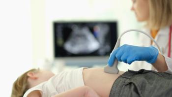  Doctor gastroenterologist making ultrasound examination of liver and pancreas to child in clinic closeup. Diagnosis and treatment of diseases of internal organs in children concep - Image credit: H_Ko | stock.adobe.com