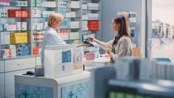 Pharmacist and Patient in Pharmacy | Image Credit: Gorodenkoff - stock.adobe.com