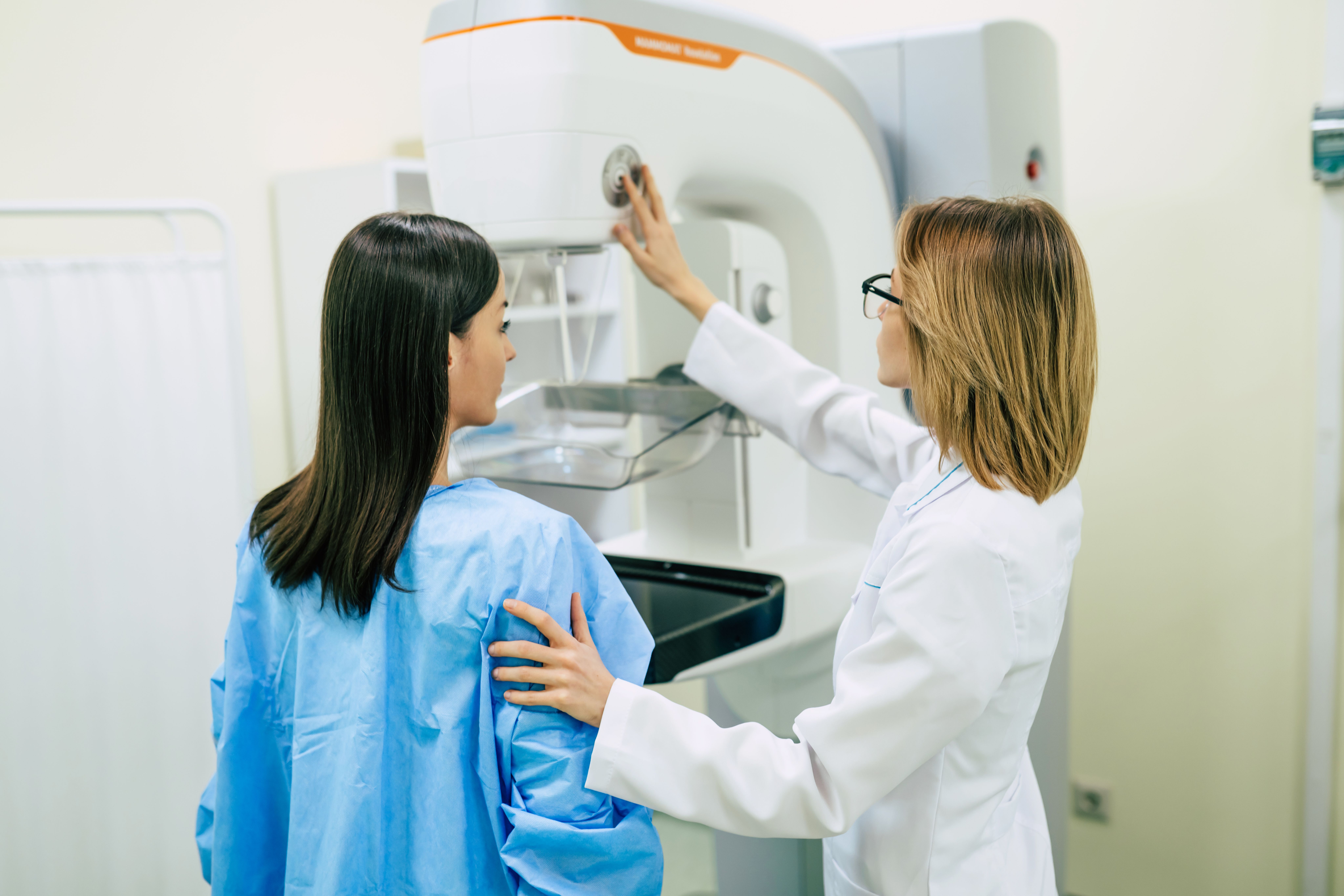 Young woman is having mammography examination at the hospital or private clinic with a professional female doctor. | Image Credit: My Ocean studio | stock.adobe.com