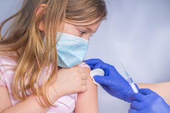 Get coronavirus vaccine concept, getting covid-19 vaccination, Doctor injecting vaccination in arm of caucasian little child girl,healthy and medical concept - Image credit: ricka_kinamoto | stock.adobe.com
