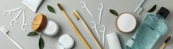 Oral care accessories on gray background, top view - Image credit: AtlasI | stock.adobe.com