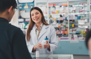 Pharmacist and a patient in the pharmacy -- Image credit: Me studio | stock.adobe.com