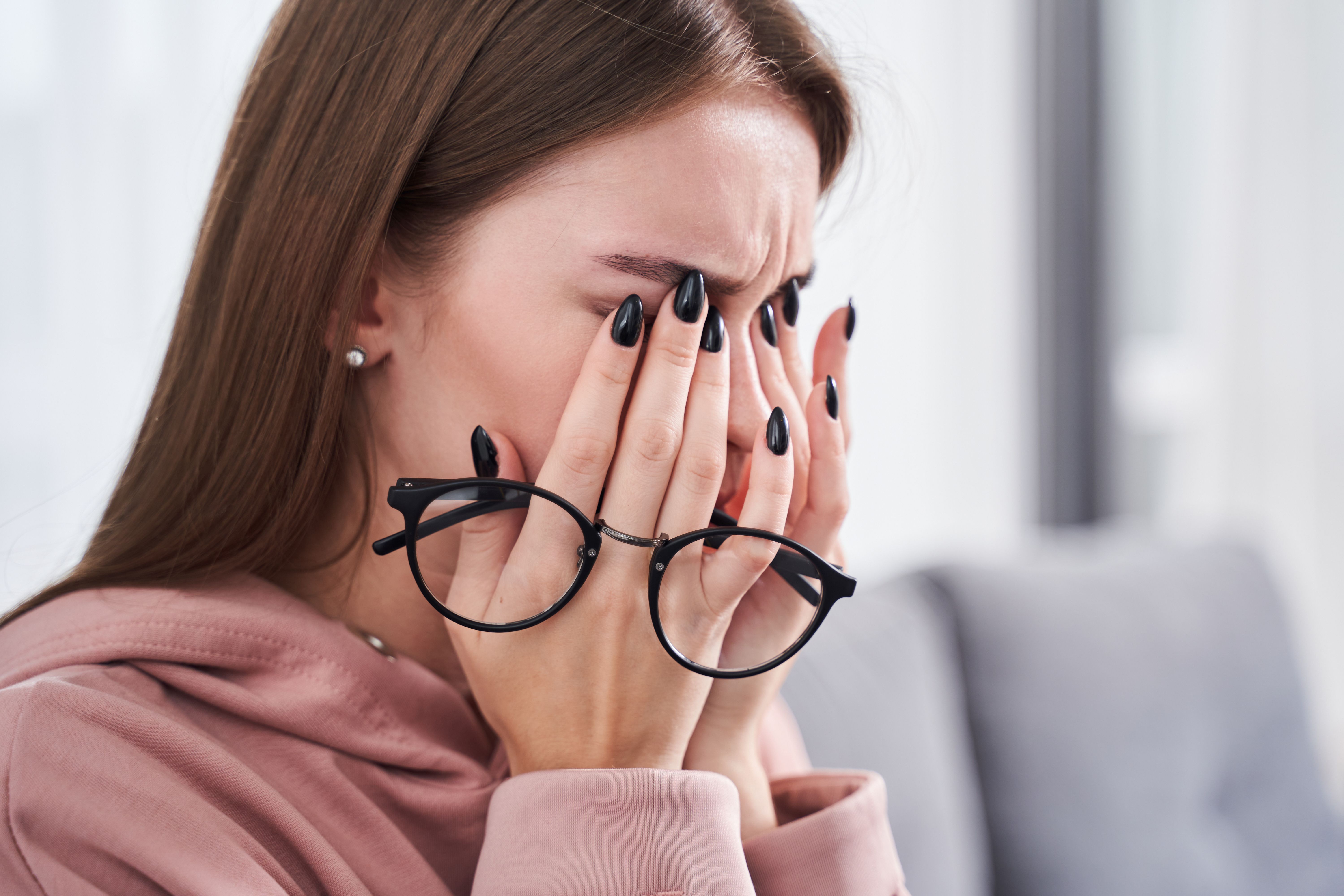 Woman suffering with dry eyes -- Image credit: Yakobchuk Olena | stock.adobe.com