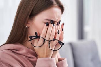 Woman suffering with dry eyes -- Image credit: Yakobchuk Olena | stock.adobe.com