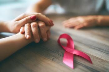 Patient with breast cancer and a loved one -- Image credit: Konstantin Yuganov | stock.adobe.com