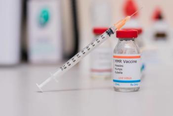 measles mumps and rubella vaccination concept with syringe in vaccine vial and other vials in background - Image credit: rohane | stock.adobe.com