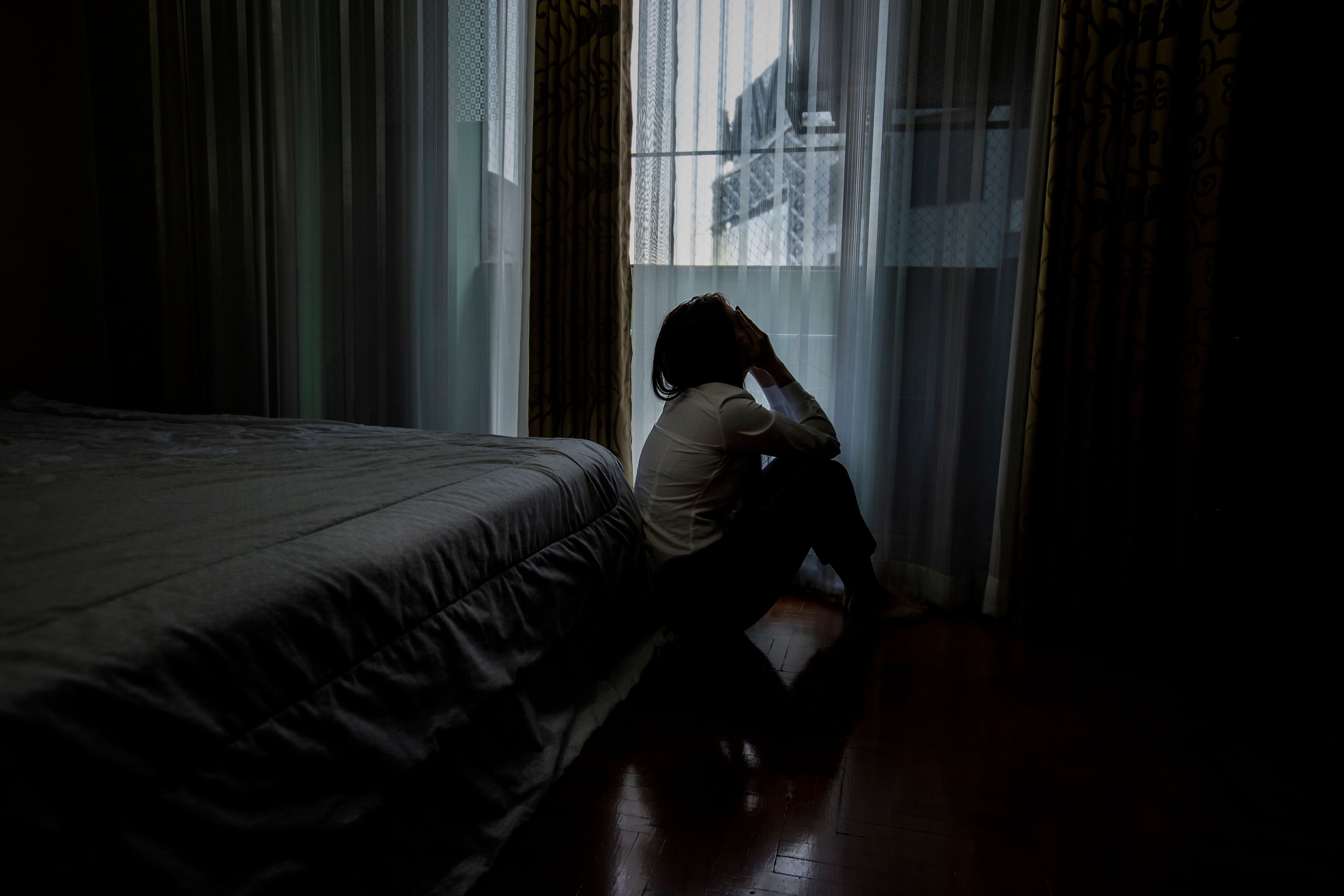 Woman with depression -- Image credit: SOMKID | stock.adobe.com