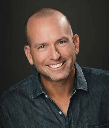 Paul Ollinger is a writer, stand-up comedian, and host of the Reasonably Happy podcast