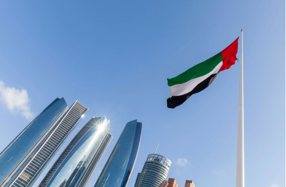 UAE flag waving in the sky, national symbol of UAE | Image Credit: © Freelancer - stock.adobe.com