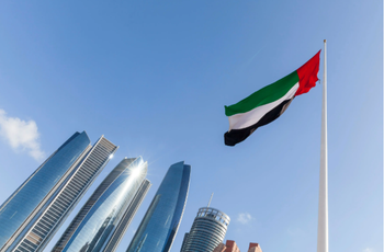 UAE flag waving in the sky, national symbol of UAE | Image Credit: © Freelancer - stock.adobe.com