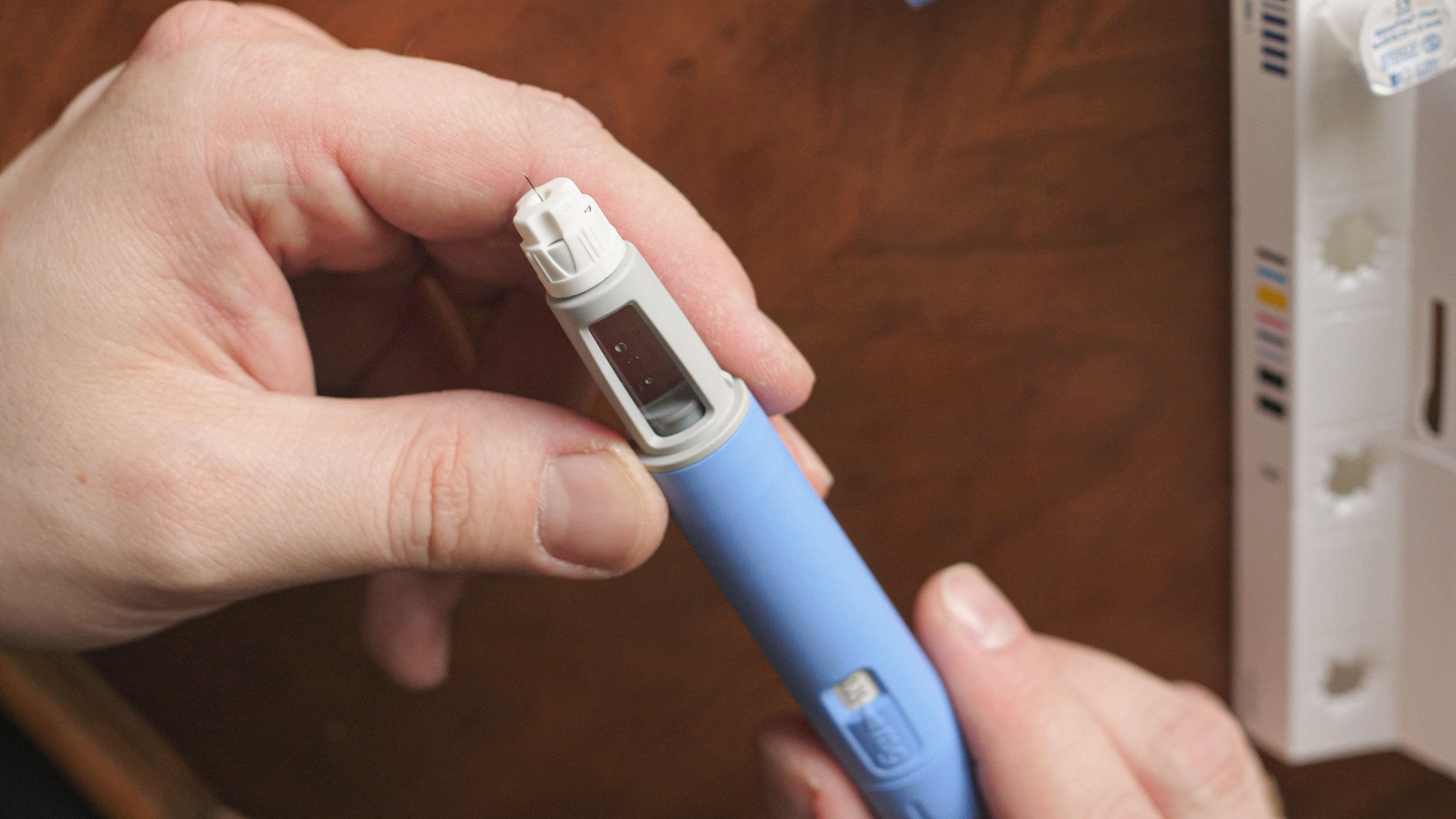 Image credit: myskin | stock.adobe.com. obese fat man preparing Semaglutide Ozempic injection control blood sugar levels