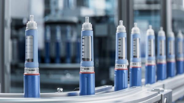 Close-up Medical Injector Pens on Conveyor Belt at Modern Pharmaceutical Factory. Insulin Pen on Production Line. Weight Loss Medication Manufacturing. Medical Drug Production Plan. | Image Credit:  ©IM Imagery -stock.adobe.com
