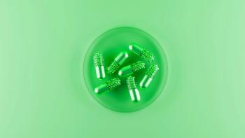 Medicinal capsules green pills in lab. Top view. 3d rendering | Image Credit: ©svitlini - stock.adobe.com