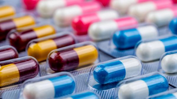 Selective focus on blue-white capsule pills in blister pack. Pharmaceutical industry. Drug package. Pharmaceutics concept. Drug use in hospital or drugstore product. Health budget. Global healthcare. | Image Credit: ©Artinun -stock.adobe.com