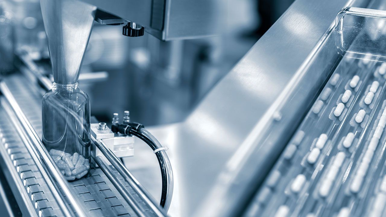 Tablet, Capsule counting machine conveyor in production line of pharmaceutical industry. | Image Credit: ©funfunphoto -stock.adobe.com