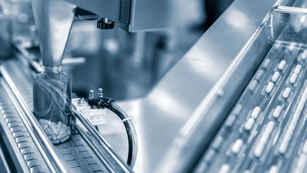 Tablet, Capsule counting machine conveyor in production line of pharmaceutical industry. | Image Credit: ©funfunphoto -stock.adobe.com