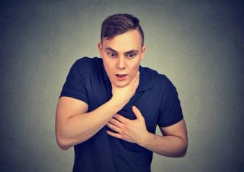 Young man having asthma attack or choking suffering from respiration problems | Image Credit: © Feodora - stock.adobe.com