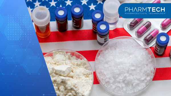 A top view of medicine powders, liquids in containers, and various manufactured medicine on the American flag. An America pharmaceuticals concept. | image Credit: ©Ming -stock.adobe.com