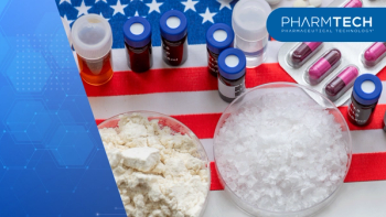 A top view of medicine powders, liquids in containers, and various manufactured medicine on the American flag. An America pharmaceuticals concept. | image Credit: ©Ming -stock.adobe.com
