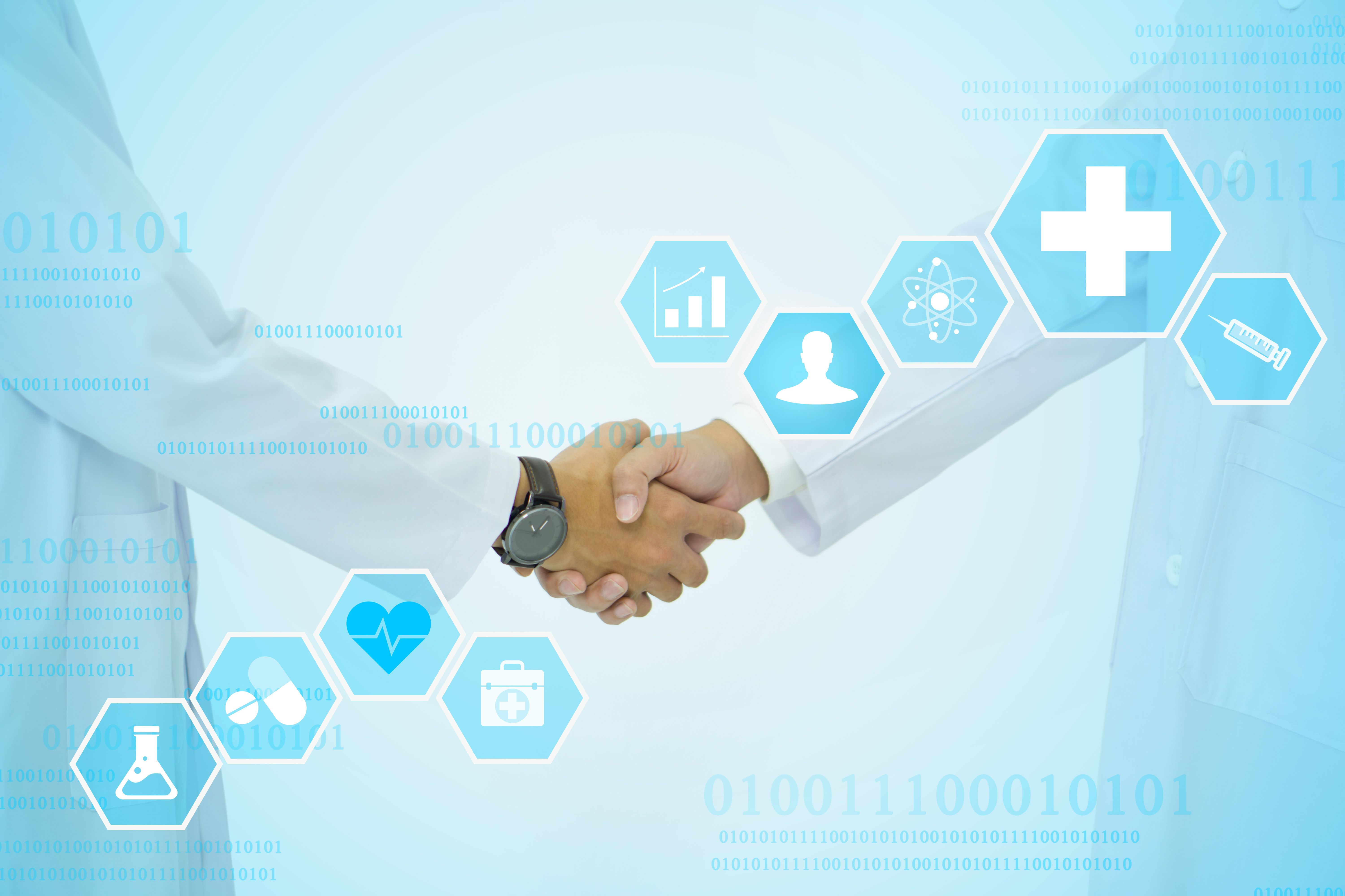 A doctor in a white lab coat shaking hand showing symbol of medicine innovation, treatment, discovery and healthcare analysis. | Image Credit: © chadchai - stock.adobe.com