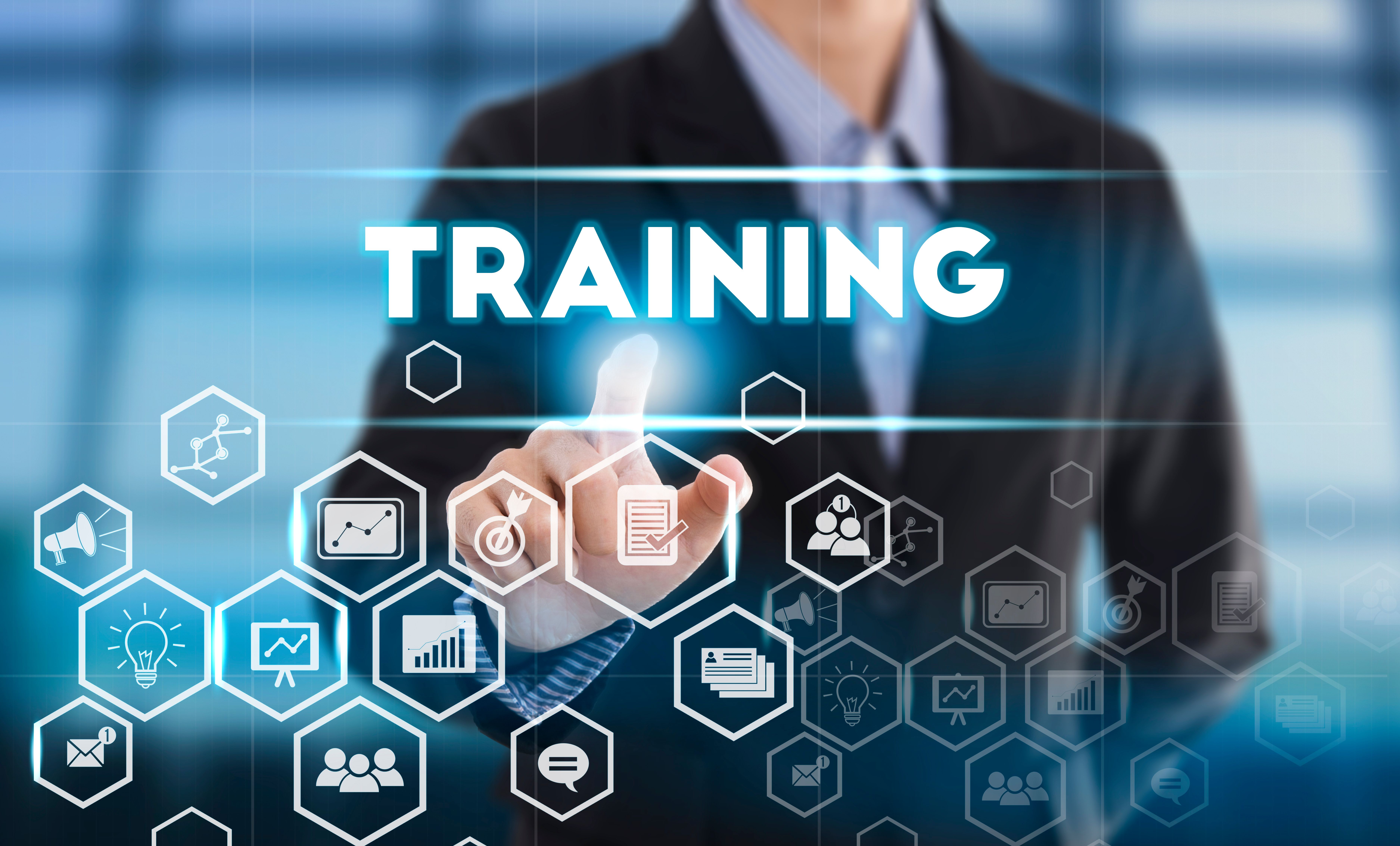 Businessman hand pressing button Training. sign on virtual screen. business Mentoring Learning Education Browsing concept | Image Credit: © NaMong Productions - stock.adobe.com