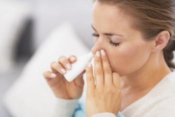 Woman using nasal drops | Image Credit: © Alliance - stock.adobe.com