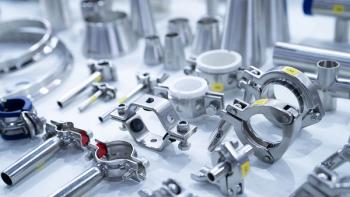 Stainless steel pipe fittings, clamps, and connectors arranged in industrial. Precision manufacturing, mechanical assembly, and hygienic processing systems for food and pharmaceutical industries. | Image Source: ©Artinun -stock.adobe.com