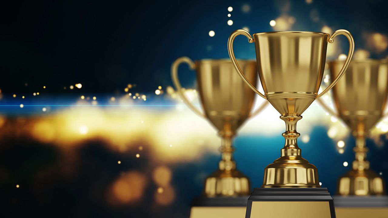 close up golden trophy award with falling confetti. copy space for text. 3d rendering. | Image Credit: © ATKWORK888X - © ATKWORK888X - stock.adobe.com