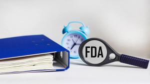FDA concept. Concept of the Food and Drug Administration. Magnifier glass, folder and clock | Image credit: © Sviatlana - © Sviatlana-stock.adobe.com
